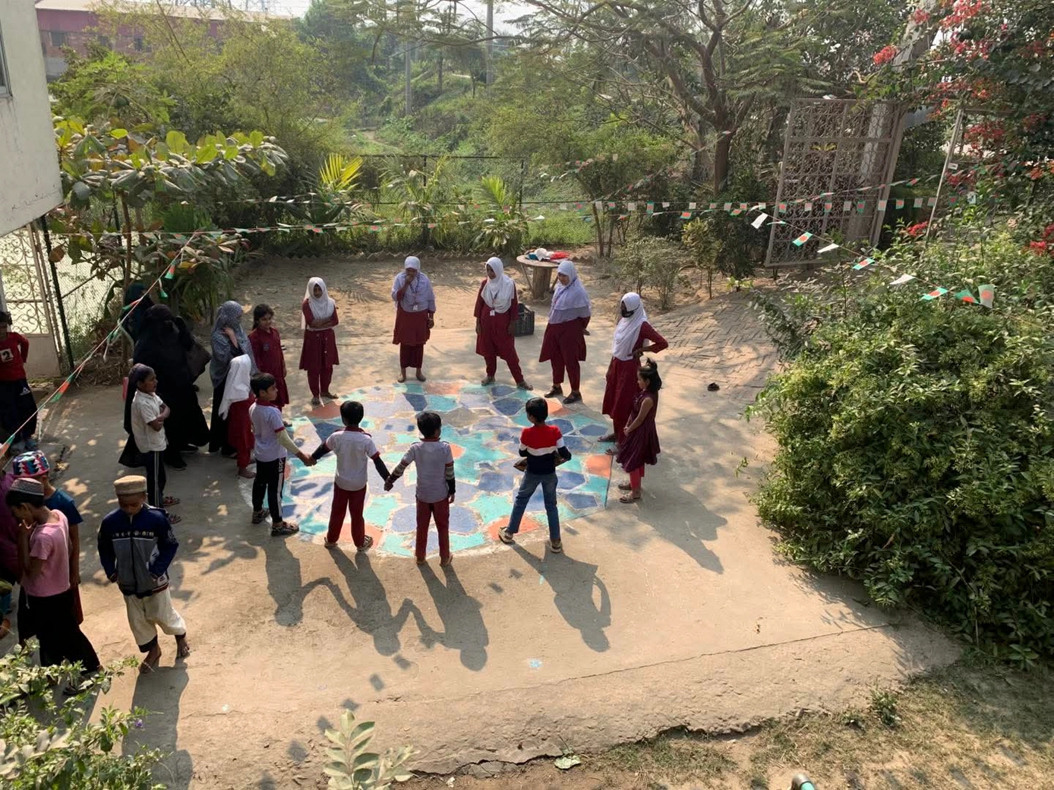 Children playing together at Shahbaz Academy